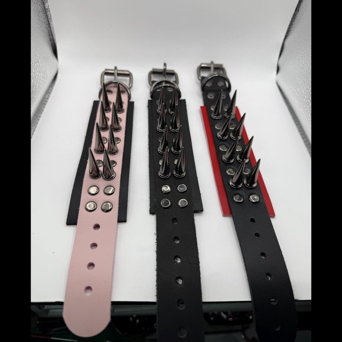 Red // Gunmetal Spiked Bracelets